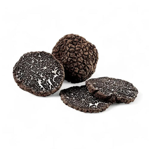 Fresh black truffle Tuber Melanosporum with marbled interior for gourmet dishes