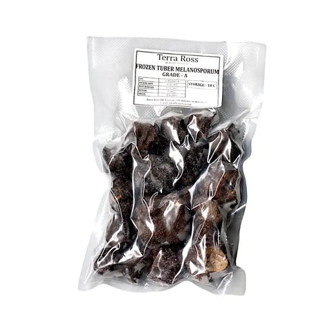 Vacuum-sealed bag of frozen black truffles Tuber Melanosporum A-grade for gourmet use